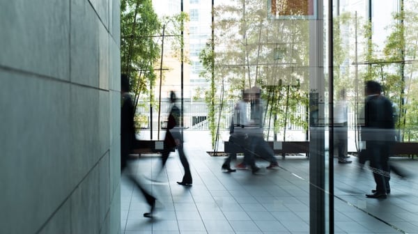 Person walking through reception area of office building